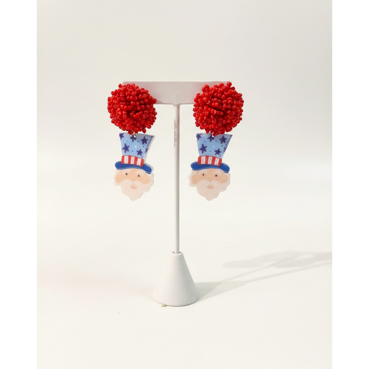 Handcrafted Uncle Sam dangle earrings with vibrant red, white, and blue patriotic details.