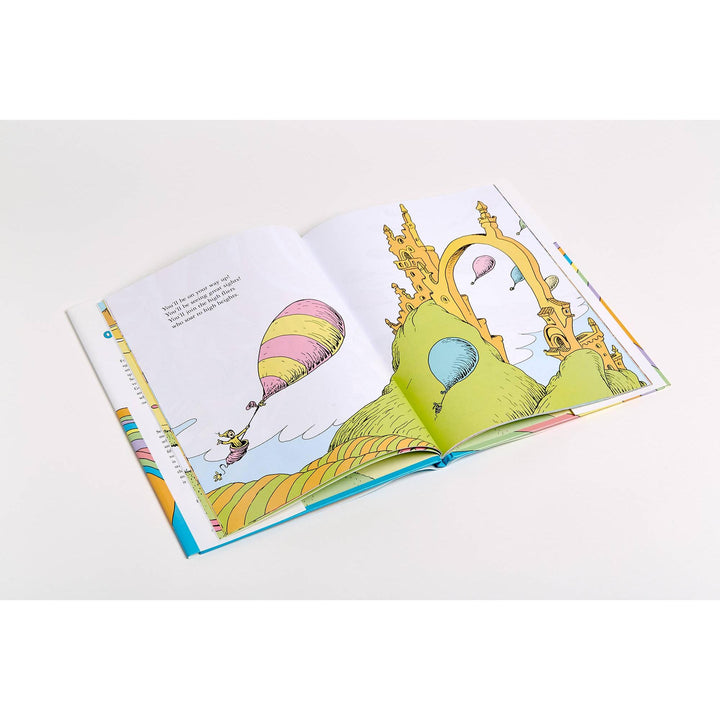 A spread from the book showing the vibrant, whimsical landscape and Dr. Seuss&
