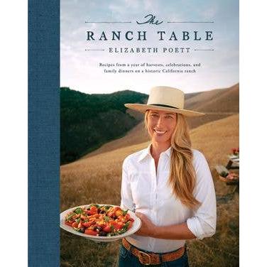 Front cover of "The Ranch Table" cookbook by Elizabeth Poett, featuring the author in a wide-brimmed hat holding a colorful salad bowl against a scenic California ranch backdrop.