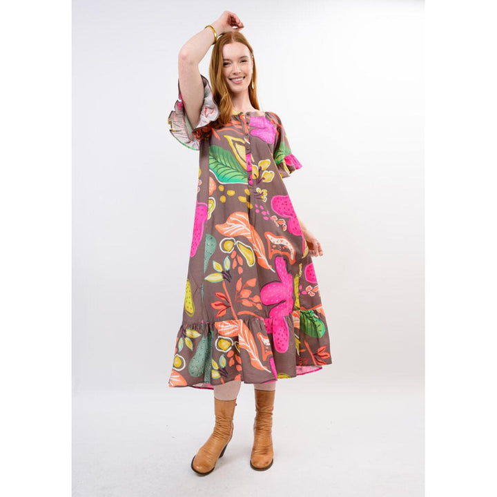 Model wearing the relaxed-fit Uncle Frank Patio Dress in Brown.