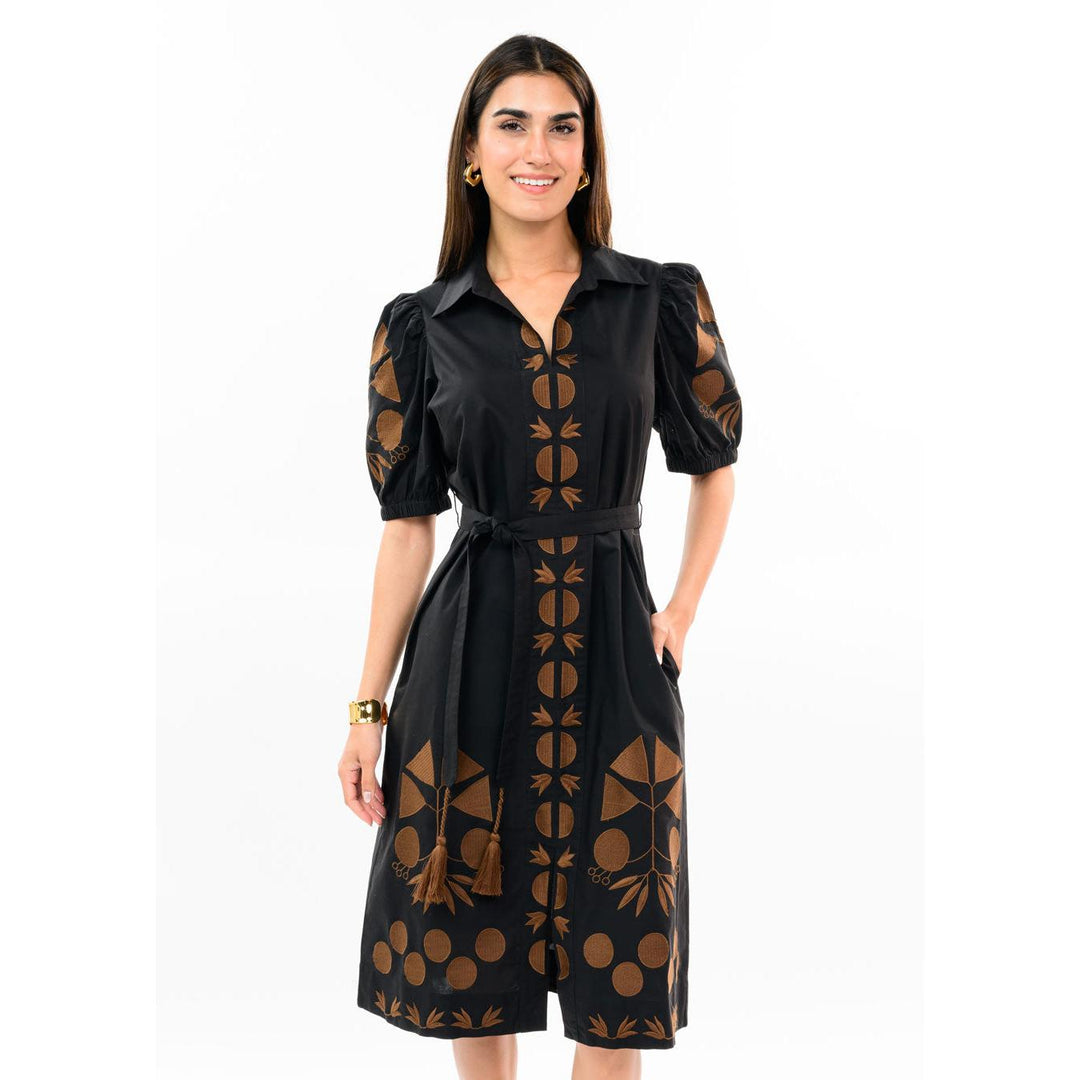 Model wearing the black Uncle Frank placket embroidered dress featuring short sleeves and a knee-length hem.