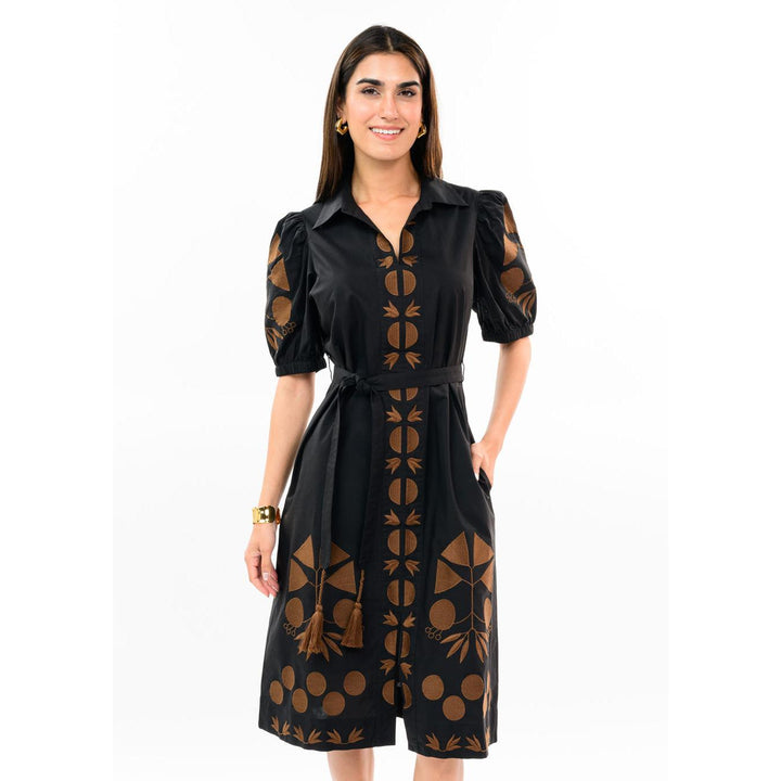 Model wearing the black Uncle Frank placket embroidered dress featuring short sleeves and a knee-length hem.