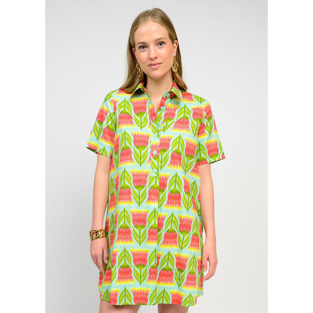 Back profile of the Swing Shirt Dress highlighting the flared swing silhouette and button-front design.