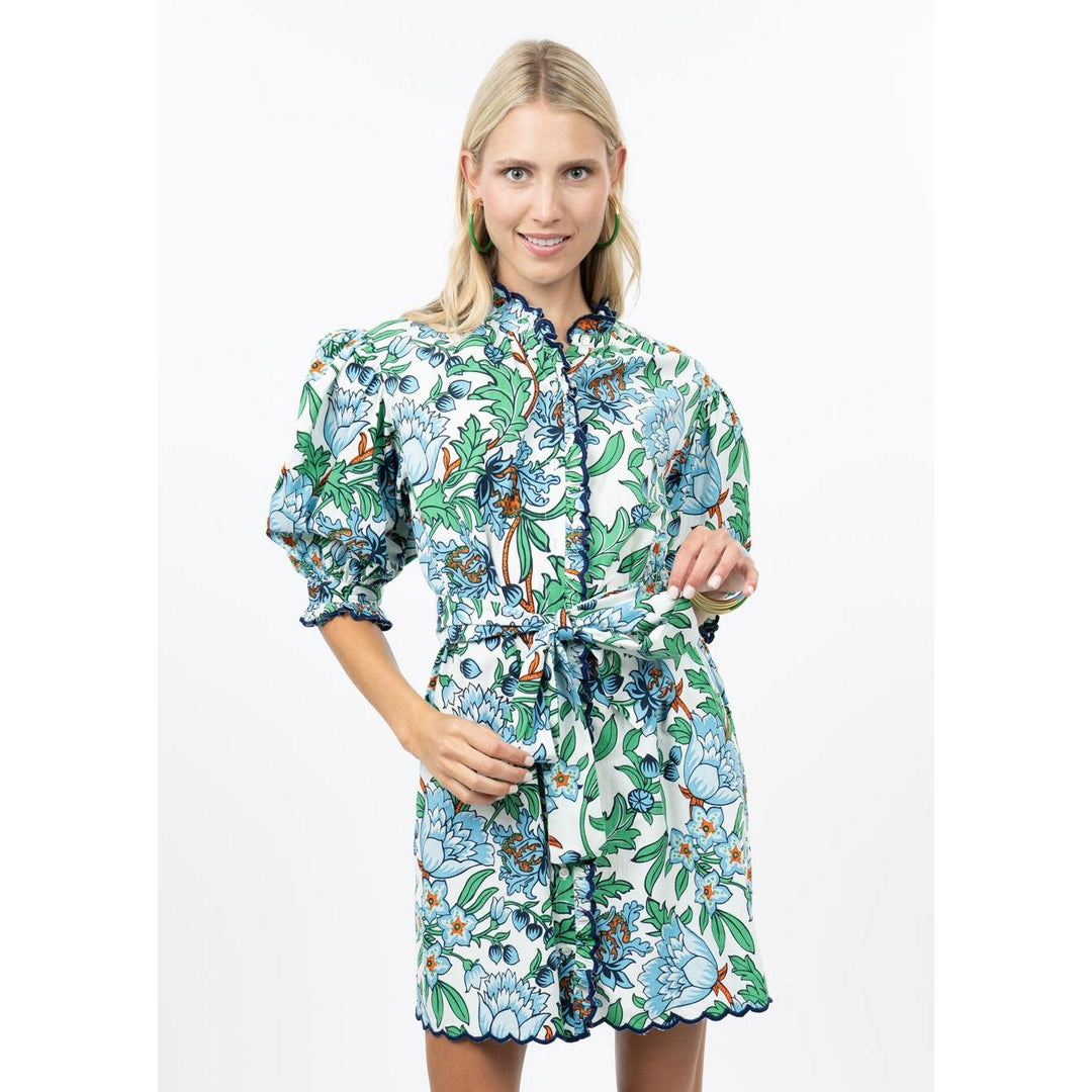 Model wearing the Uncle Frank Scallop Front floral mini dress highlighting the relaxed fit and puff sleeves.