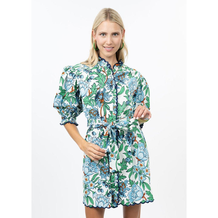 Model wearing the Uncle Frank Scallop Front floral mini dress highlighting the relaxed fit and puff sleeves.