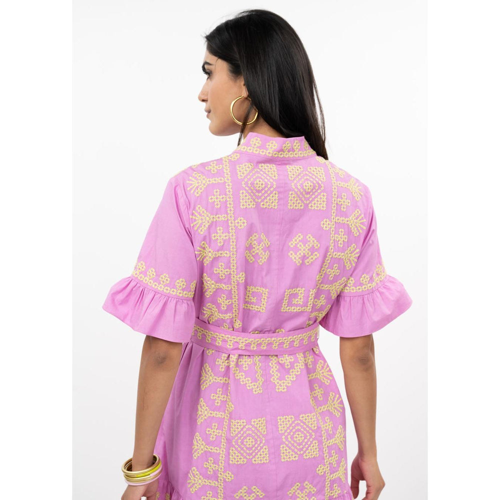 Model wearing the pink Cross Stitch mini dress by Uncle Frank, showcasing the relaxed fit.