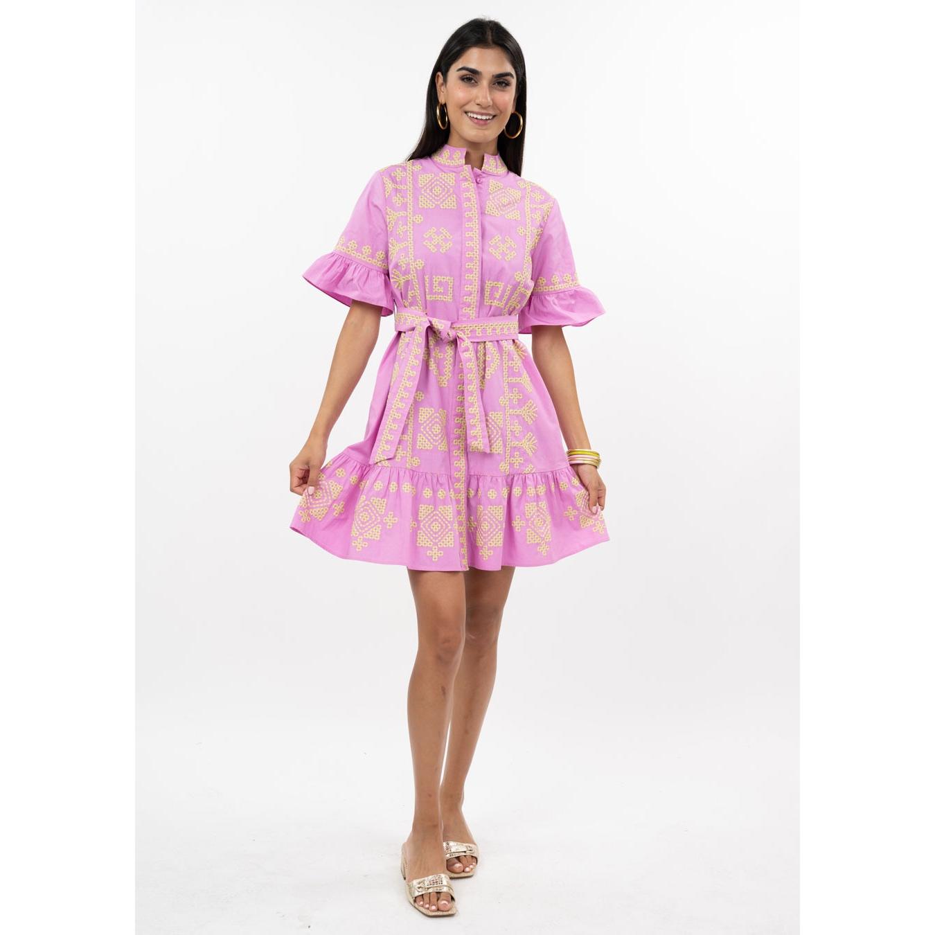 Close-up of the pink fabric on the Cross Stitch Dress highlighting the intricate embroidered-style texture.