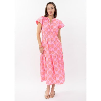 Back profile of the hot pink Clip Daisy Dress highlighting the breezy cotton fabric and refined cut.