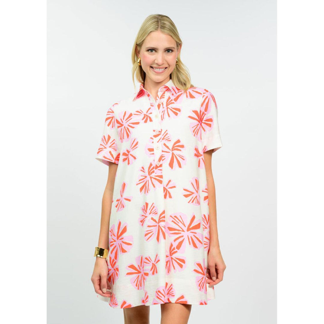 Uncle Frank Swing Shirt Dress in white with pink and orange floral print; features a button-down front and short sleeves.