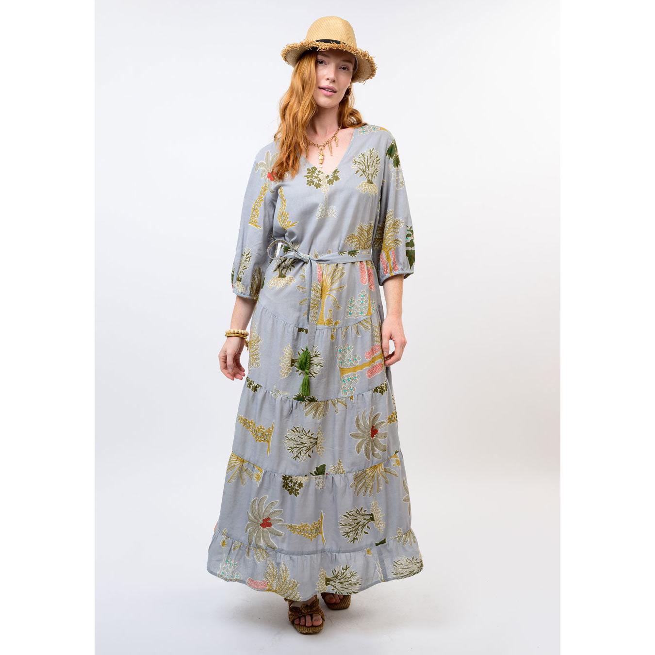 The flowing tiered silhouette and midi length of the Uncle Frank Palm Beach floral dress.