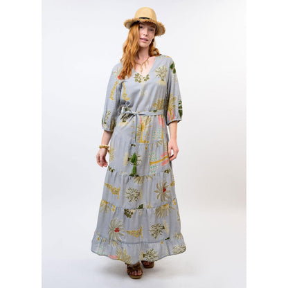 The flowing tiered silhouette and midi length of the Uncle Frank Palm Beach floral dress.