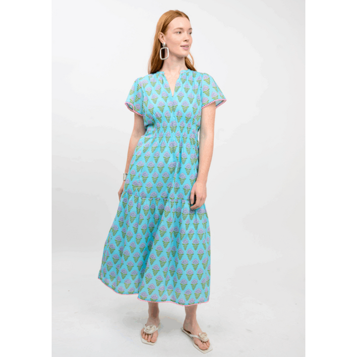 Uncle Frank Lavender Blooms Dress featuring a tiered midi silhouette and 3/4 puff sleeves.
