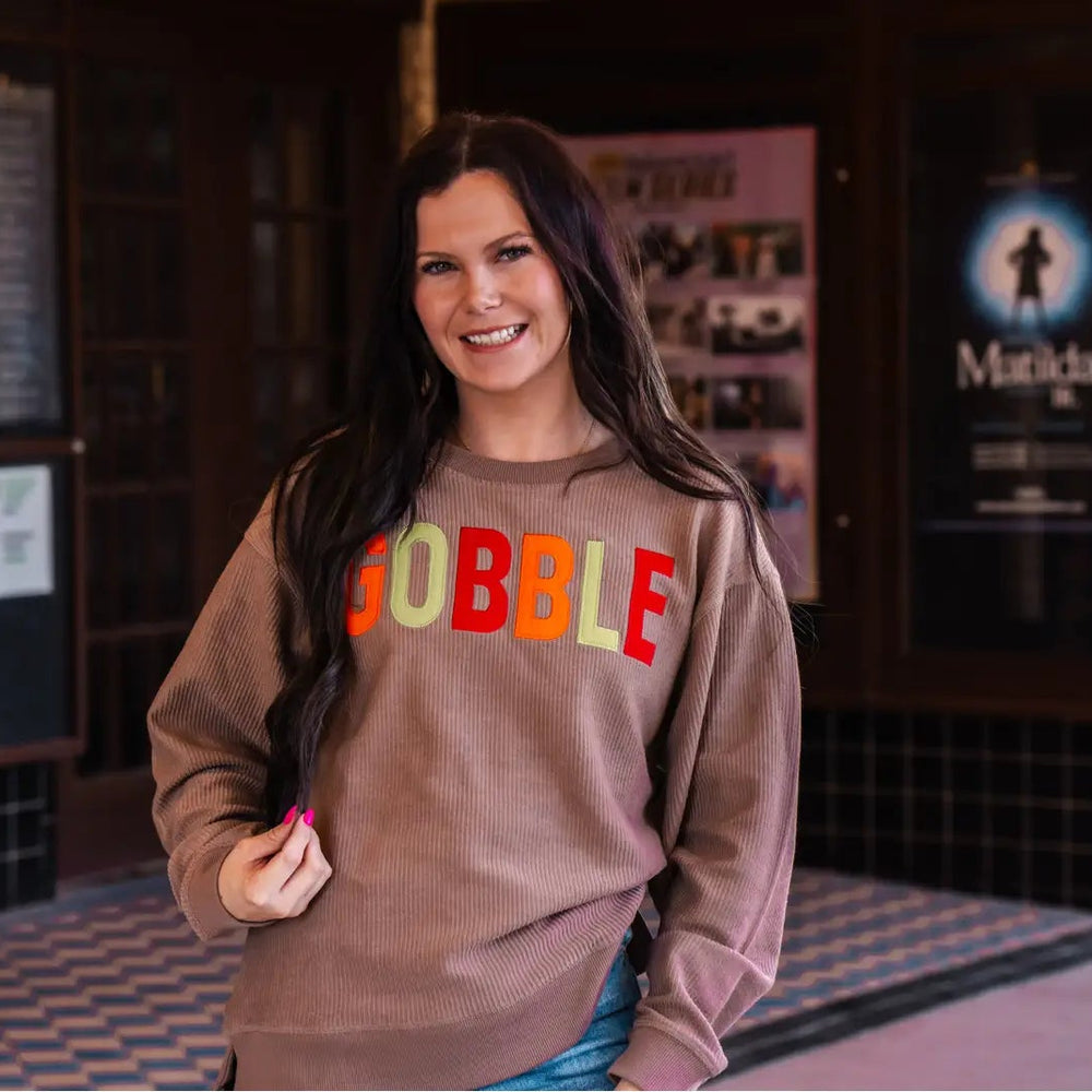 Spirit to a Tee brown cozycord crewneck sweatshirt featuring the word "Gobble" in textured tackle twill lettering.