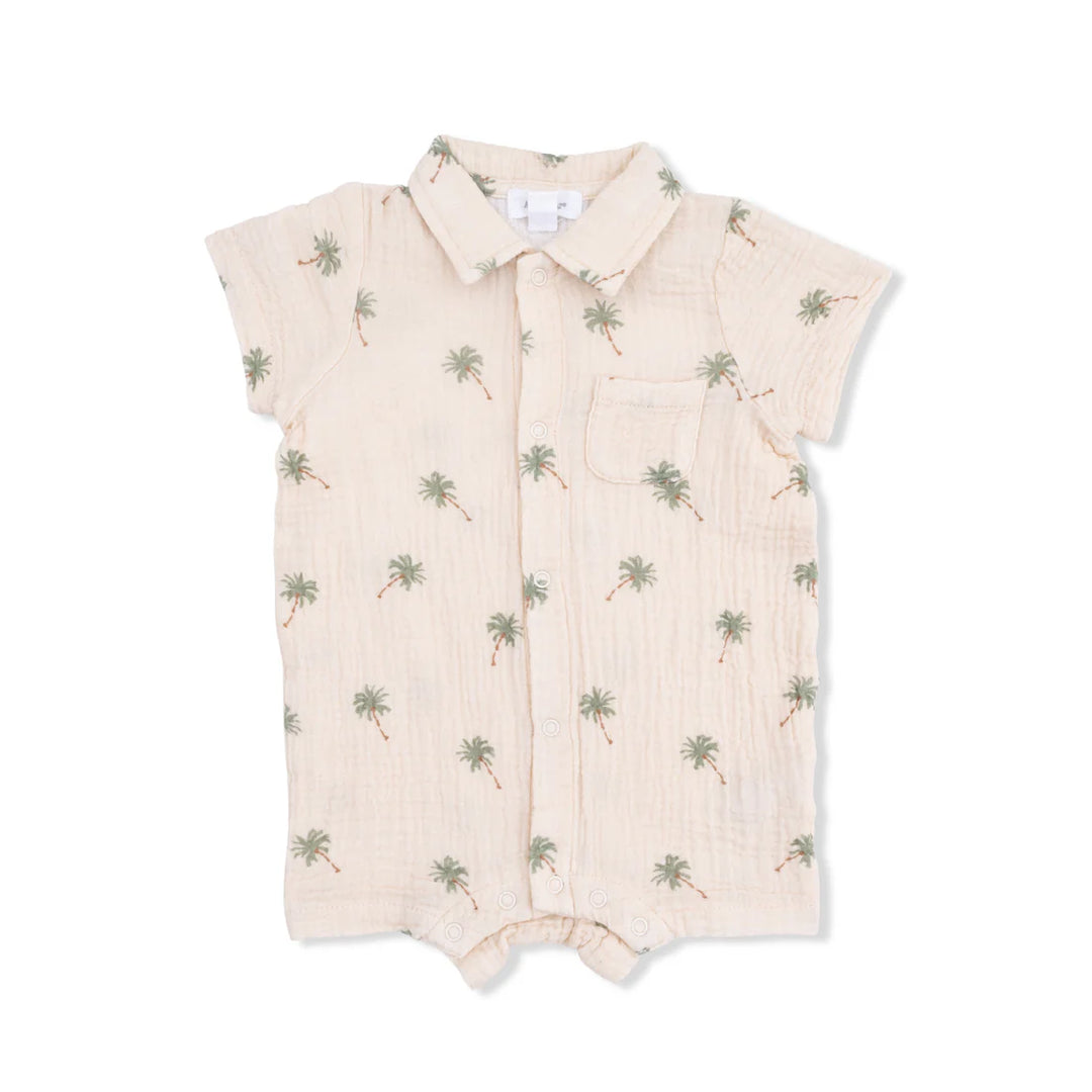 Baby boy organic muslin polo shortie with a green palm tree print on an alabaster background