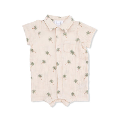 Baby boy organic muslin polo shortie with a green palm tree print on an alabaster background