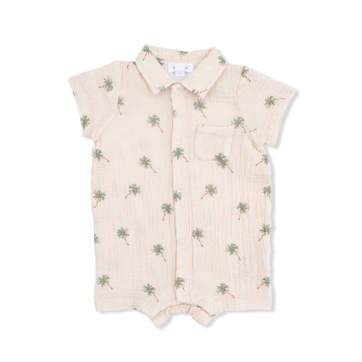Baby boy organic muslin polo shortie with a green palm tree print on an alabaster background