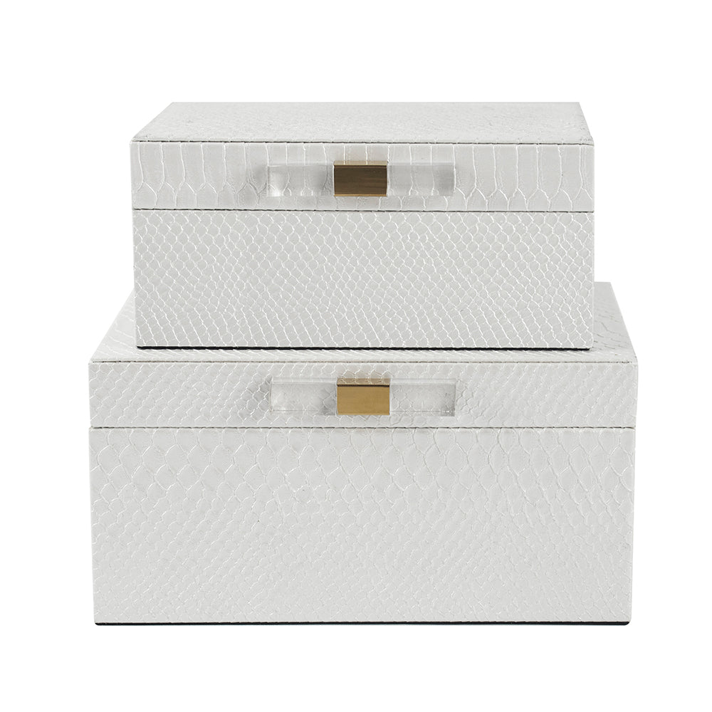 Set of two white textured storage boxes with gold latches on a white background