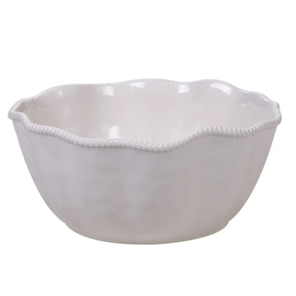 A beautifully set table featuring the Certified International Perlette Cream ceramic deep serving bowl with elegant beaded edges.