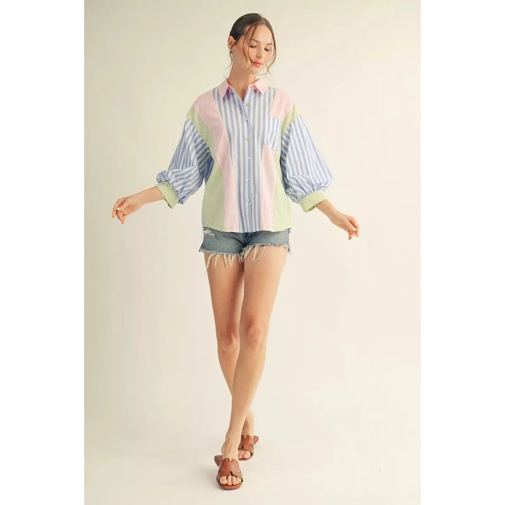 Jodifl Margot button-down shirt in a blue and pink mixed stripe pattern with 3/4 puff sleeves and a chest pocket.
