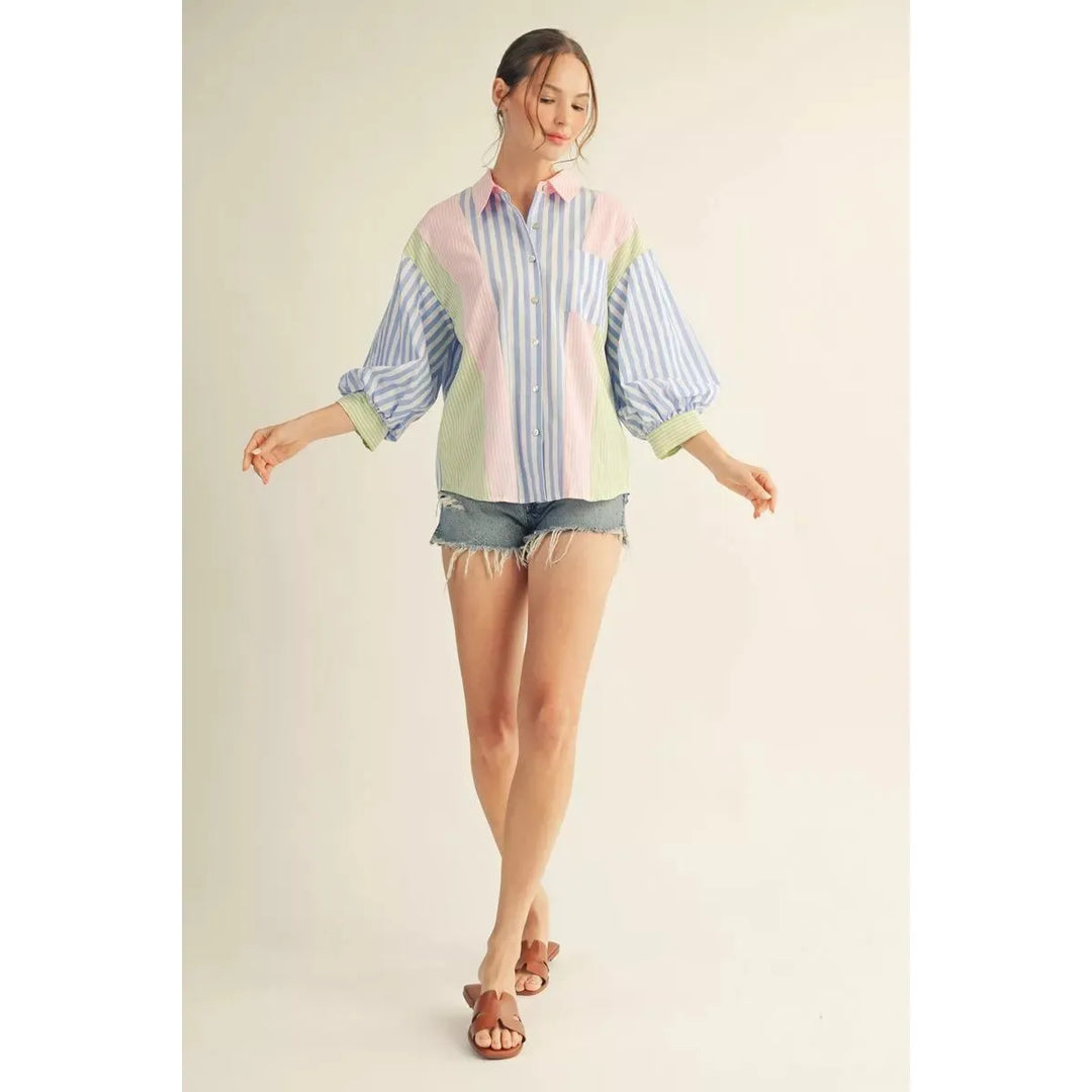 Jodifl Margot button-down shirt in a blue and pink mixed stripe pattern with 3/4 puff sleeves and a chest pocket.