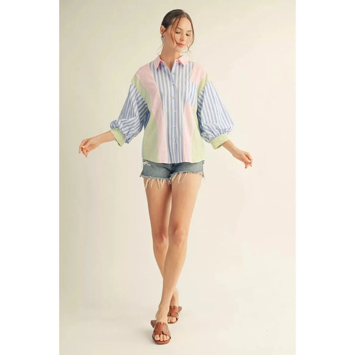 Jodifl Margot button-down shirt in a blue and pink mixed stripe pattern with 3/4 puff sleeves and a chest pocket.