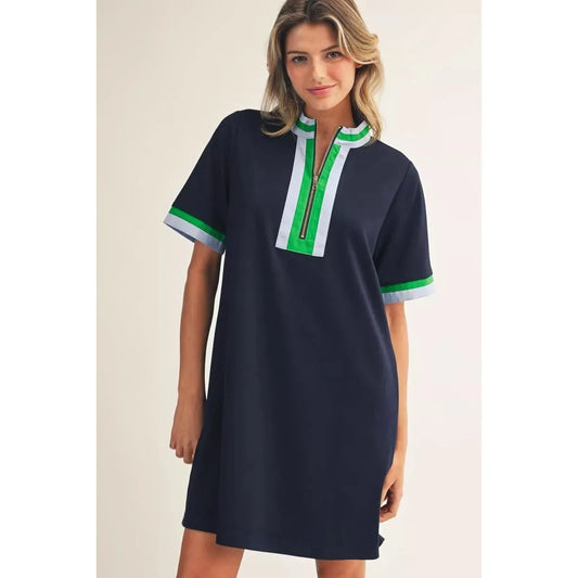 Jodifl Georgia short sleeve dress in navy blue with a front zip-up closure, mock neckline, and light contrast trim.