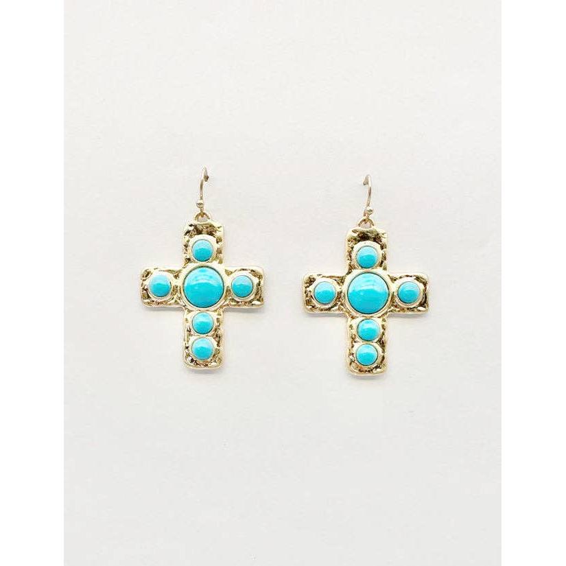 Cross-shaped earrings with turquoise stones on a white background