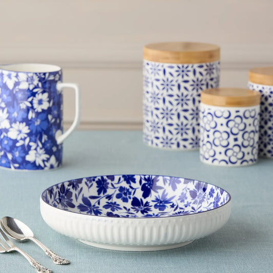 Certified International Madison Collection 12-inch large serving bowl featuring a blue and white floral interior and white ribbed exterior