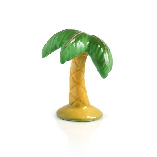 Ceramic palm tree figurine on a white background