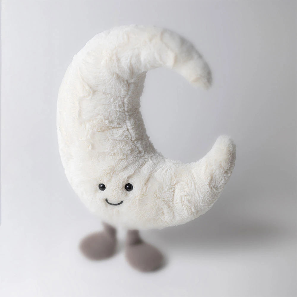 Jellycat Amuseables Moon plush toy featuring a soft white crescent shape, brown corduroy legs, and a happy stitched smile.