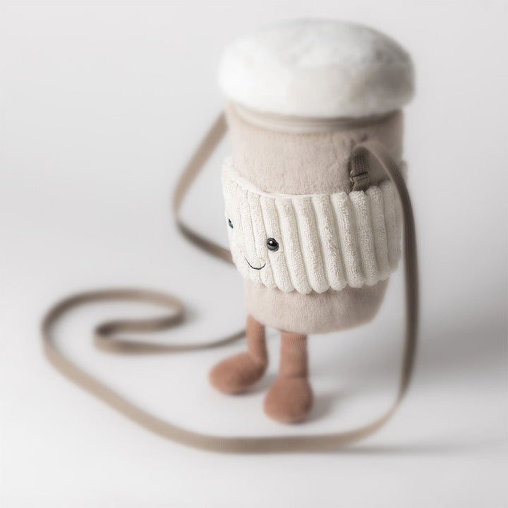 Jellycat Amuseables Perkle Coffee Bag showing mocha plush exterior and zip closure, side view