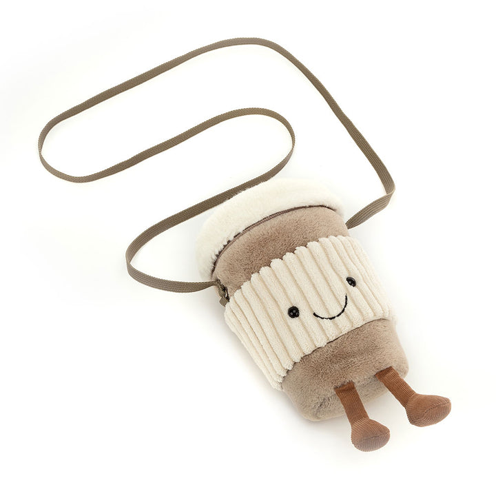 Jellycat Amuseables Perkle Coffee Bag being worn as a crossbody bag, lifestyle view