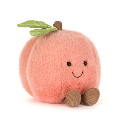 Soft peach-colored Jellycat Amuseables Peach plush with a green leaf and brown corduroy legs.