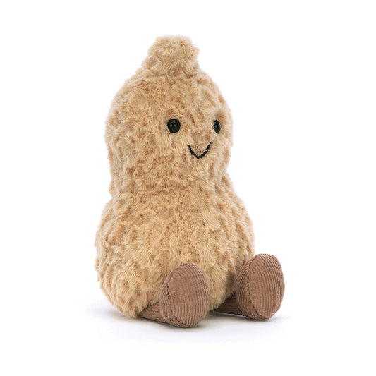 Small, smiling light-brown plush peanut by Jellycat with brown corduroy legs and a tuft of hair.
