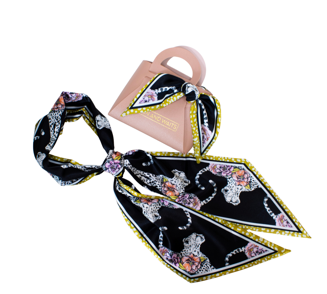 Shop the Winton and Waits Genevieve Accessory Scarf! Inspired by the classic Twilly, this versatile modal satin scarf is perfect for styling hair or handbags.