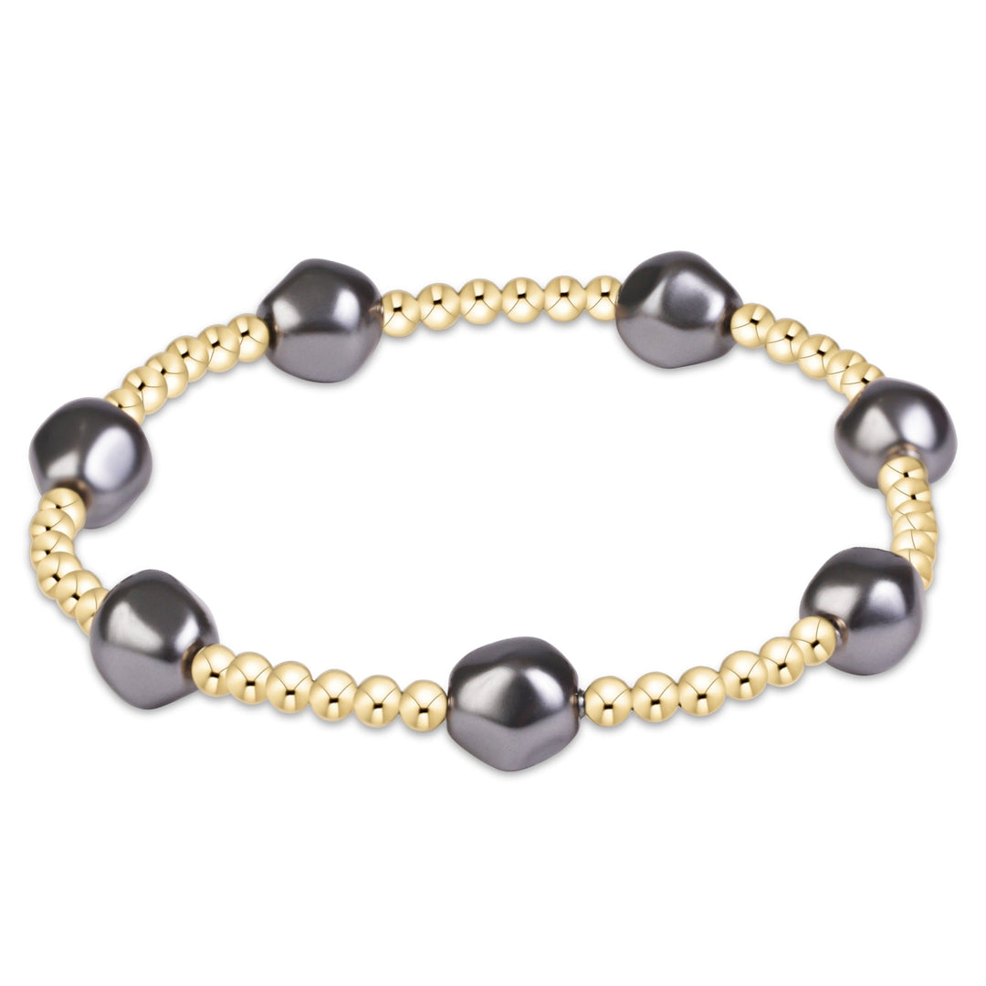 enewton Extends Admire beaded bracelet in dark grey pearl with 3mm gold-filled beads, shown stacked on the wrist