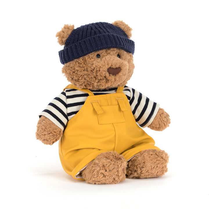 Jellycat Bartholomew Bear plush wearing a removable navy and white sailor outfit costume.