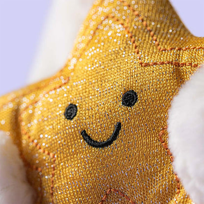 Close-up of the Jellycat Cream Bunny showing the textured golden star and signature long ears