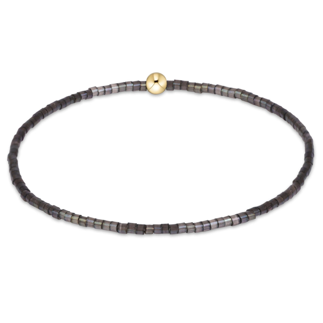 enewton Hope Classic bracelet in Moonlight soft grey seed beads with a gold accent bead, shown on the wrist