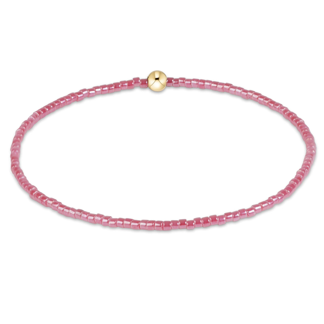 enewton Hope Classic bracelet in Pink Champagne rosy seed beads with a gold accent bead, shown on the wrist