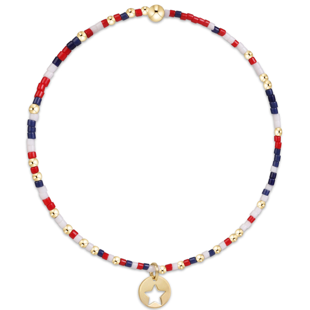 enewton design Hope Unwritten Bracelet in Firecracker highlighting its red, white, and blue seed beads and 14k gold-filled star disc charm.
