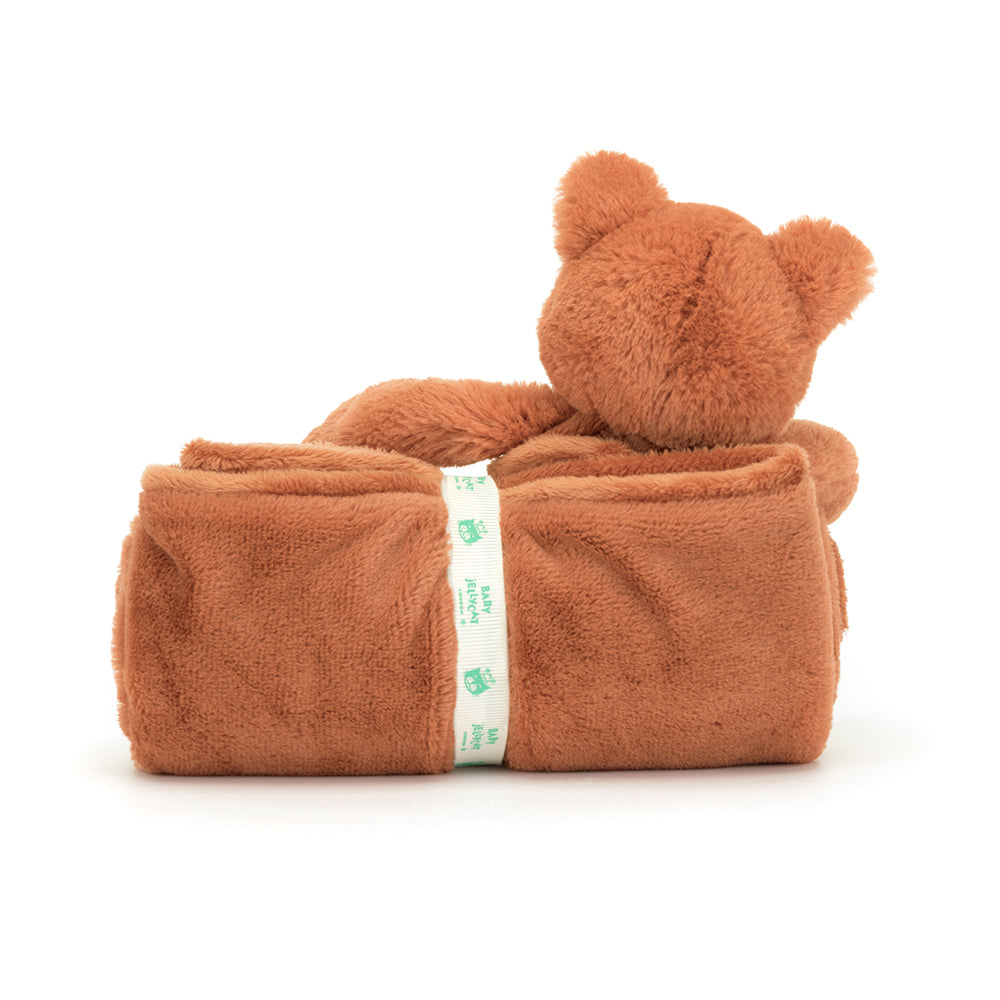 Jellycat Bashful Fox Cub Blankie neatly rolled and tied with a ribbon, featuring a soft plush fox head and terracotta ears.