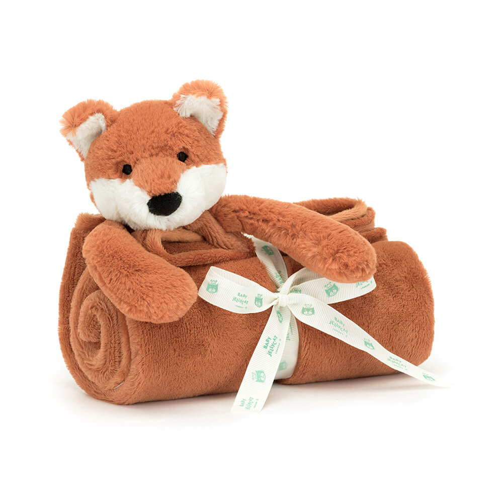 Jellycat Bashful Fox Cub Blankie neatly rolled and tied with a ribbon, featuring a soft plush fox head and terracotta ears.