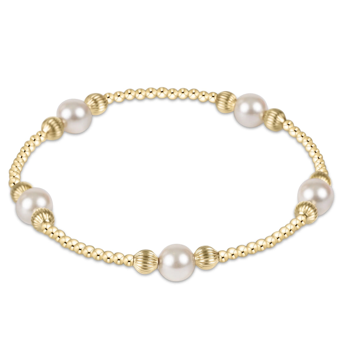 enewton 6mm crystal pearl bracelet with 14kt gold-filled beads in the Purpose Dignity pattern; waterproof and stackable.