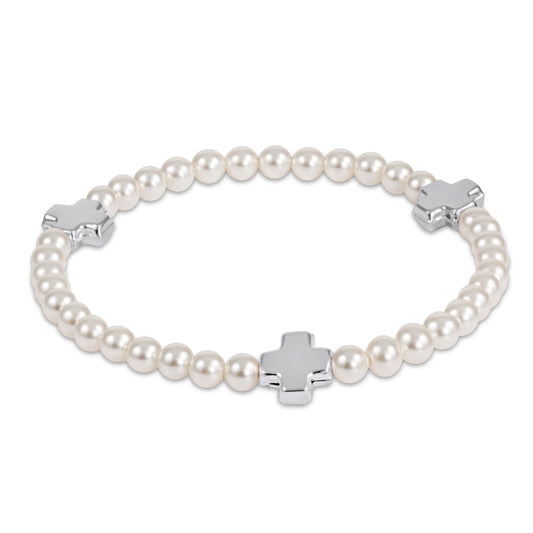 enewton Pearl bracelet with silver crosses on a white background