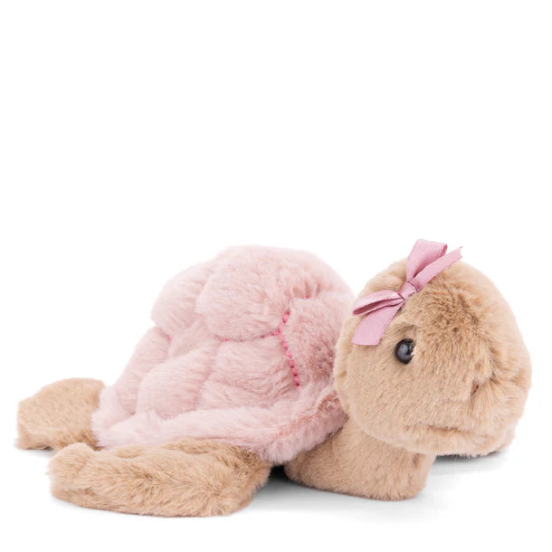 Small plush sea turtle with a soft pink shell and a pink bow on its head.