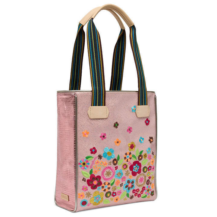 Side profile of the Rosaline Chica Tote showing the pink metallic panels and natural leather trim.