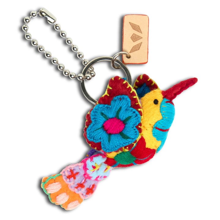 Consuela Solita bird-shaped bag charm with vibrant colors and clip-on attachment from the Summer Capsule collection.