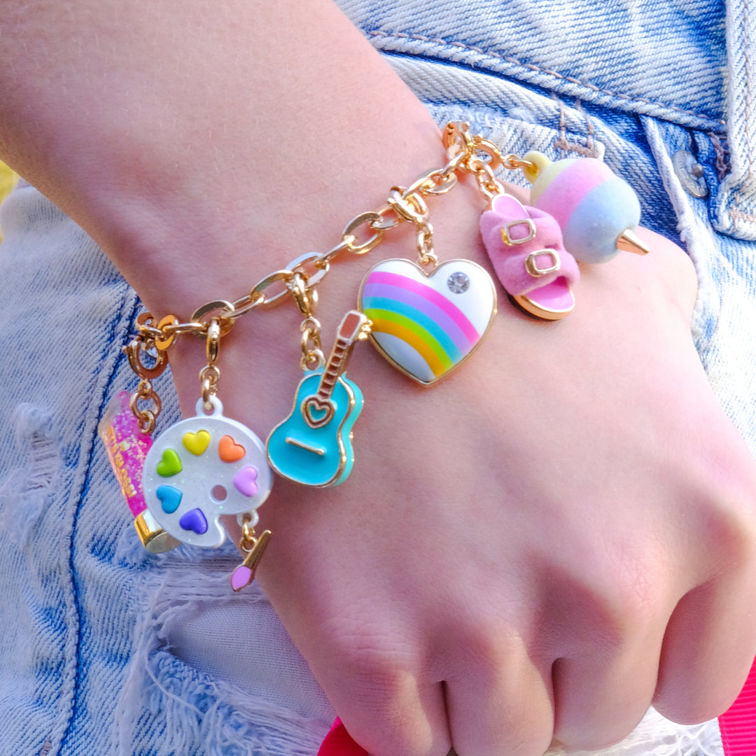 Charm It Gold Furry Pink Sandal charm styled on a girls charm bracelet