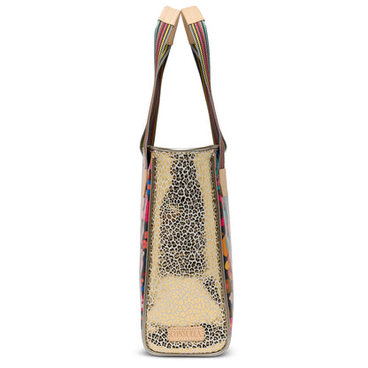 Side profile of the structured Amelie Classic Tote highlighting the woven handles and leather accents.